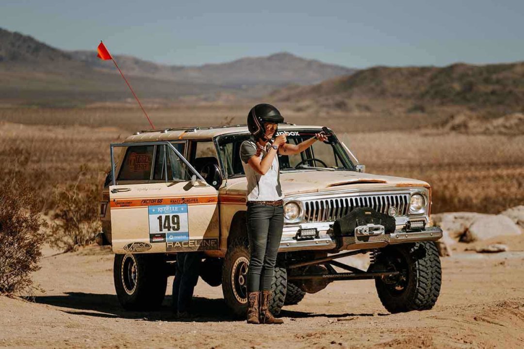 Courtney Latter in front of her 1969 Jeep Wagoneer.