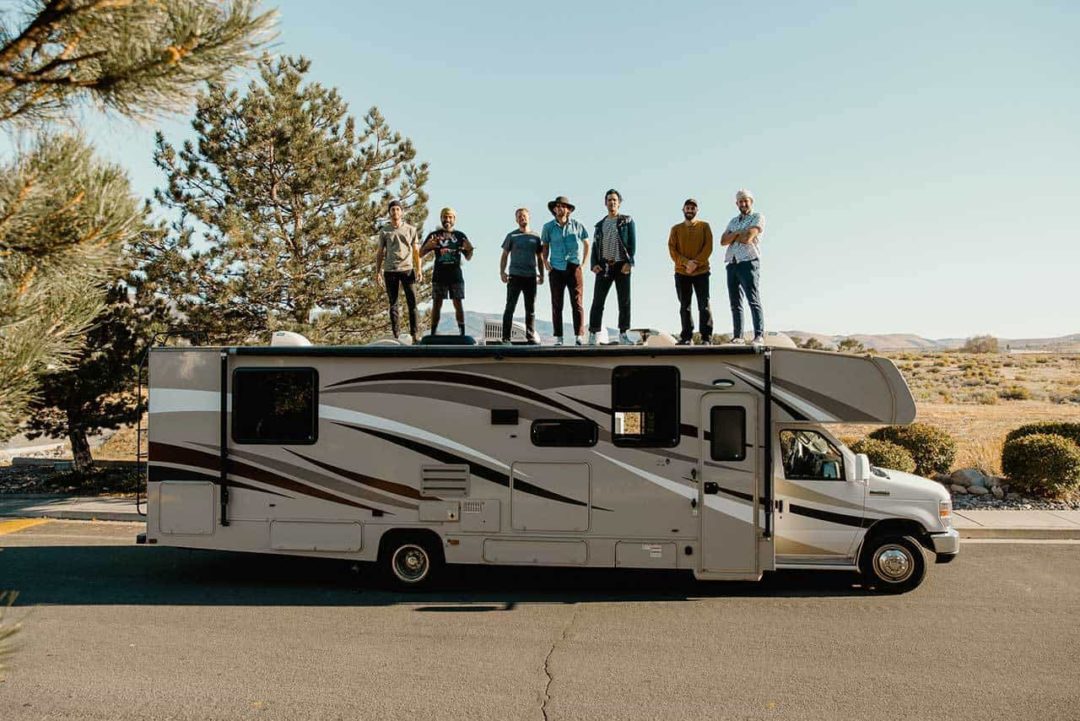 The whole "Rolling" crew on top of Madonna the RV.