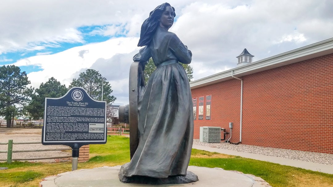 A life-size bronze statue of a woman in Cheyenne. 