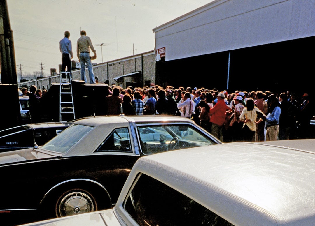 Brock Yates addresses the large crowd assembled at the Goodwives shopping center before the 1979 Cannonball. 