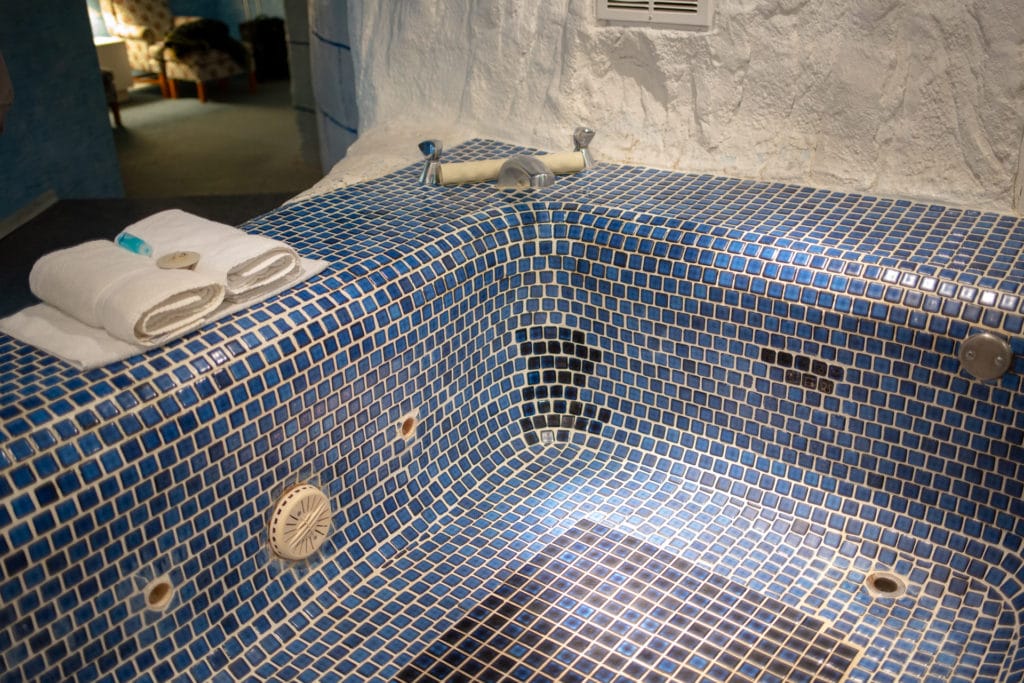 The whirlpool tub in the igloo room is an icy blue
