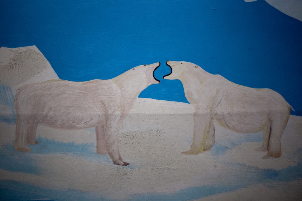Two polar bears are painted on the wall of the Northern Lights suite