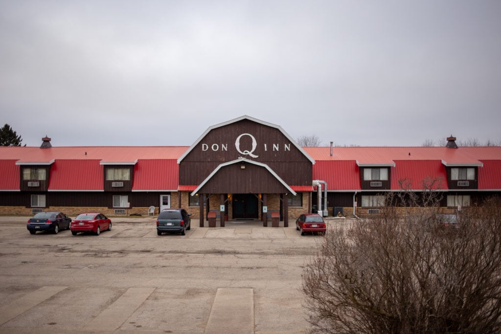 The outside of the Don Q Inn looks like a barn with a red roof