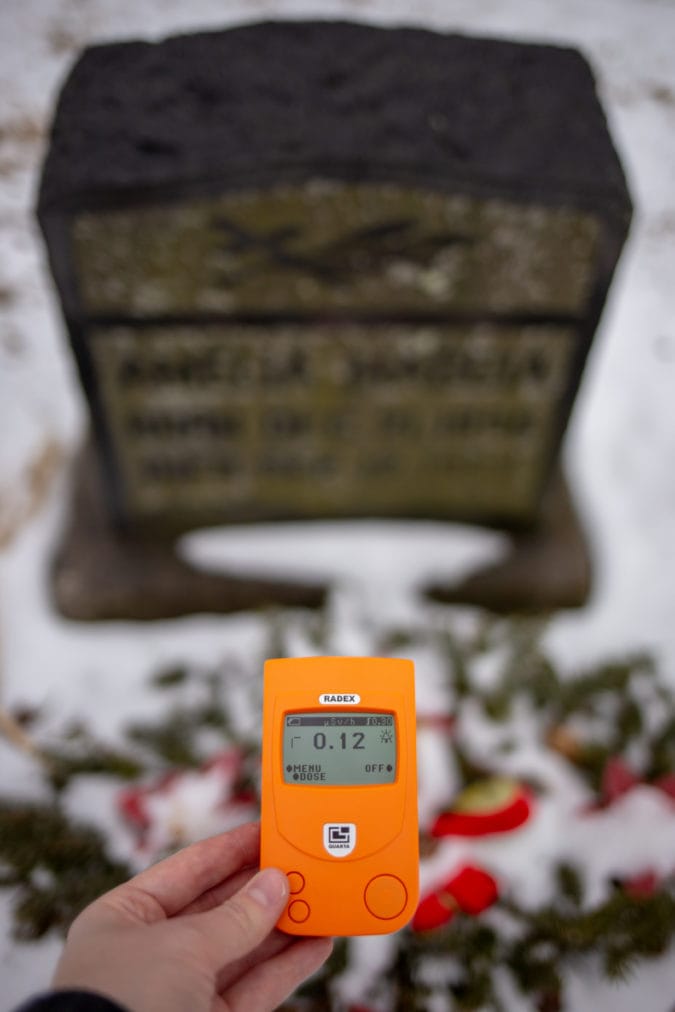 Testing the radiation at Mollie's grave with a geiger counter