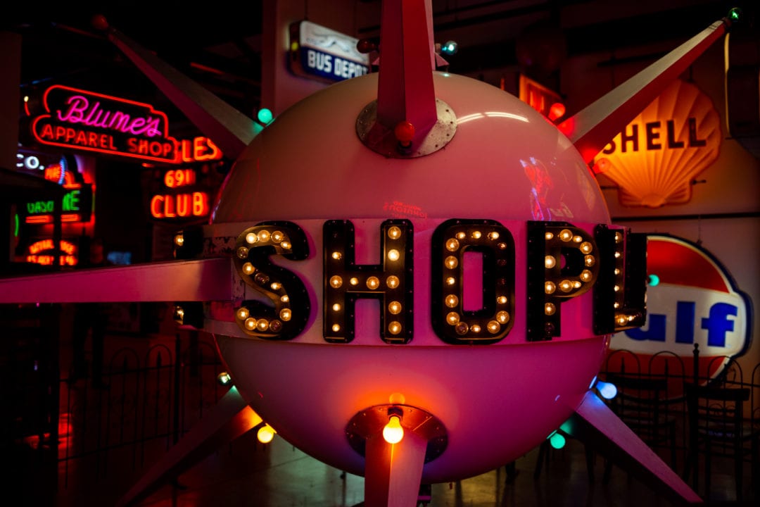 A large, orb-shaped neon sign at the American Sign Museum