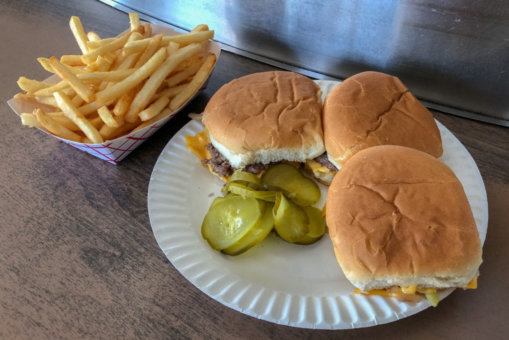 Three cheeseburgers and fries