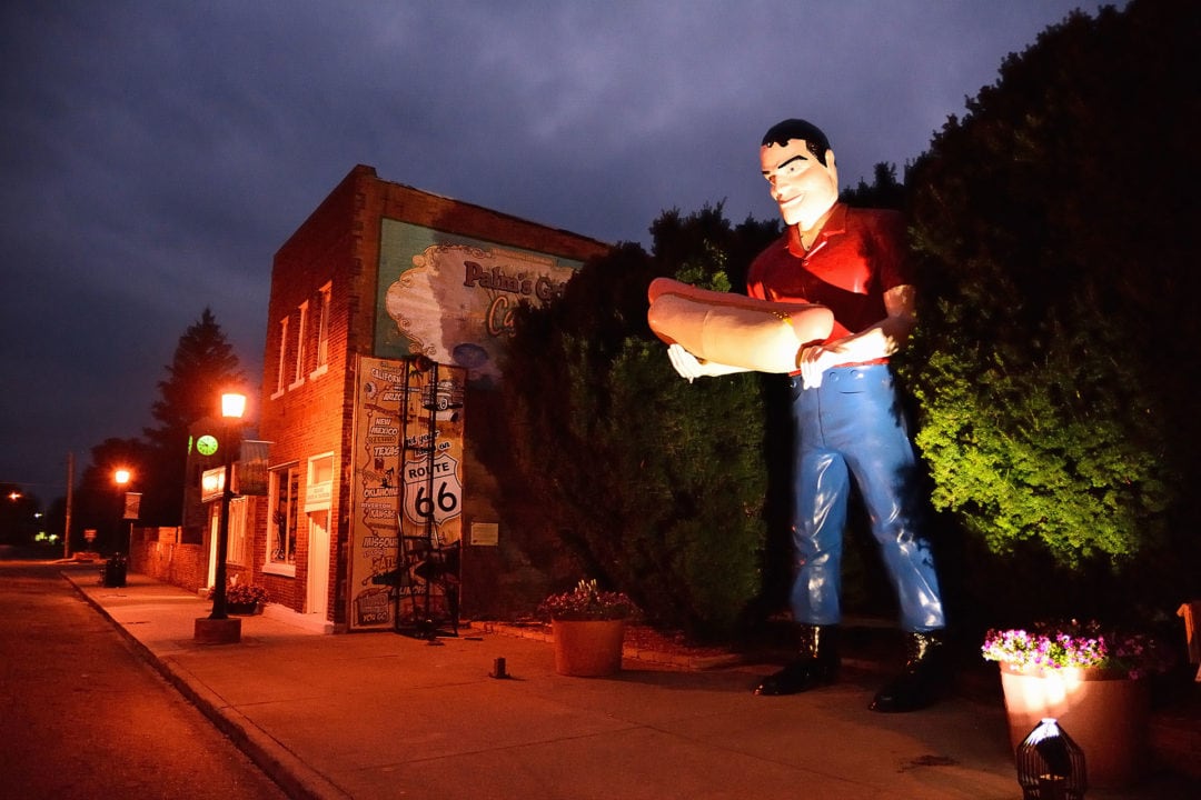 "Tall Paul," a roadside attraction holding a hot dog, on Route 66 in Atlanta, Illinois.