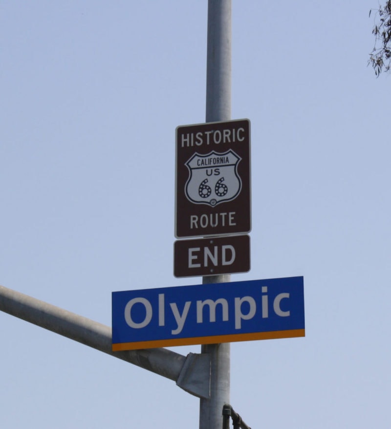 Road sign that reads "Historic Route 66 end"