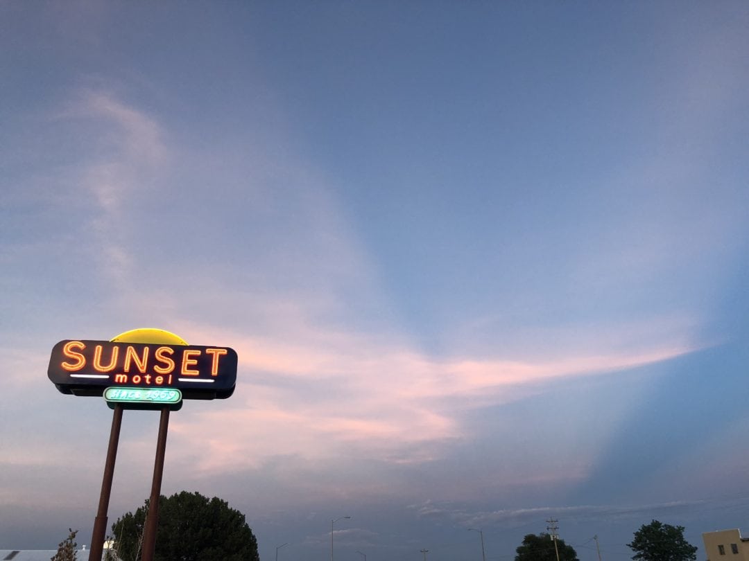 The Sunset Motel sign at sunset.