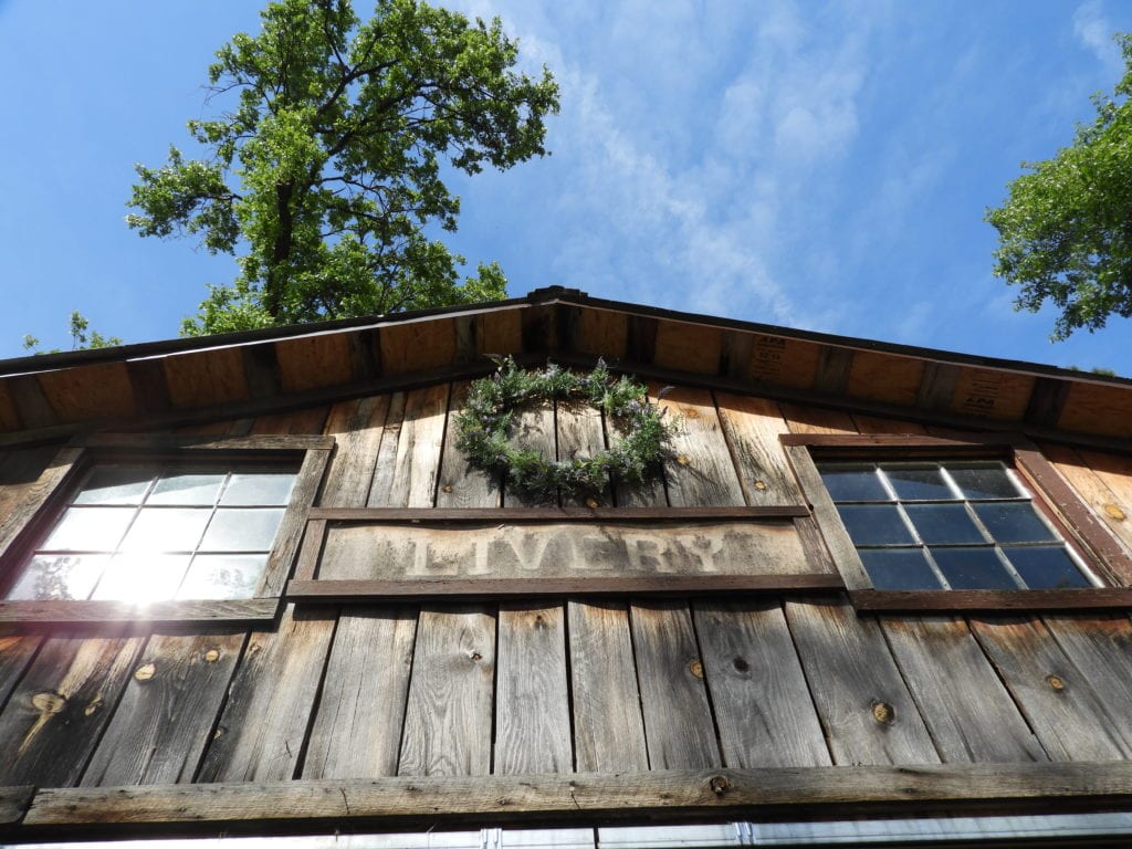Sign and wreath above the barn