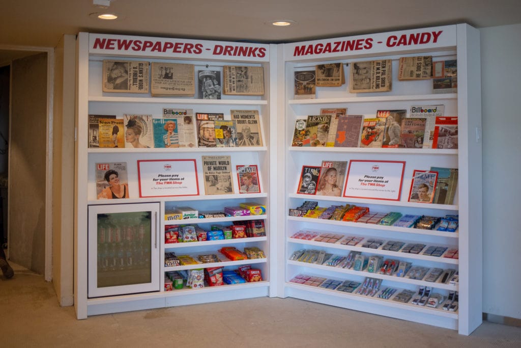 A kiosk stocked with vintage magazines and newspapers