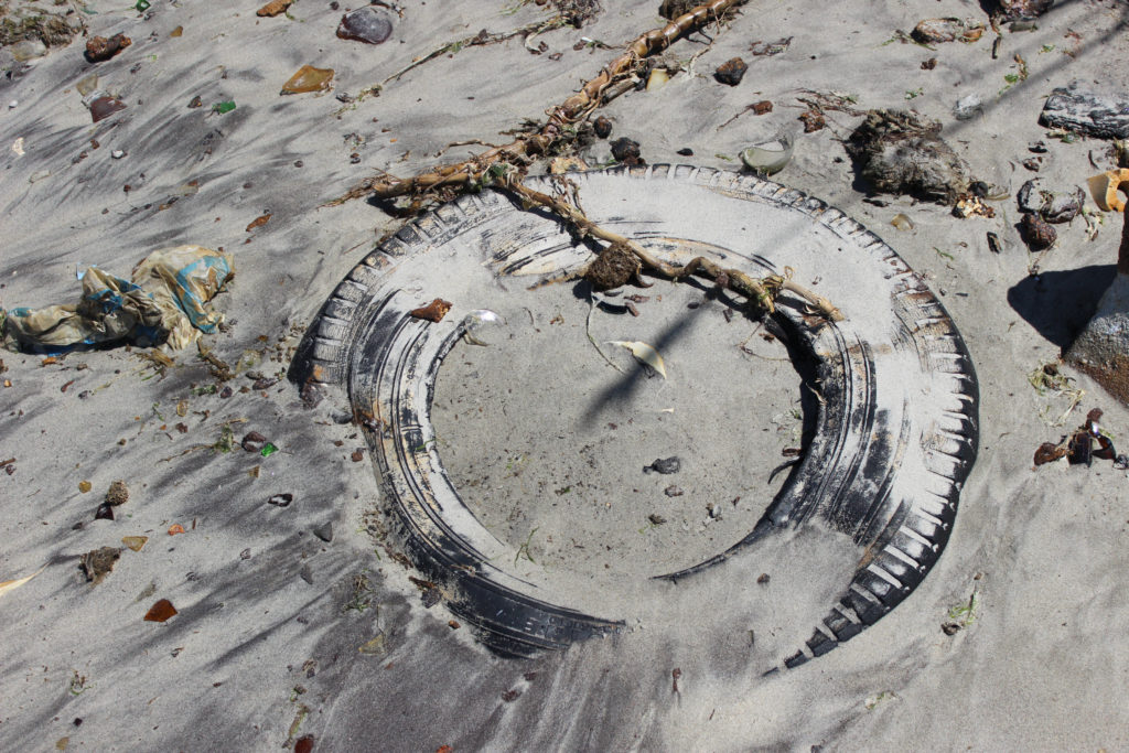 a tire buried in the sand