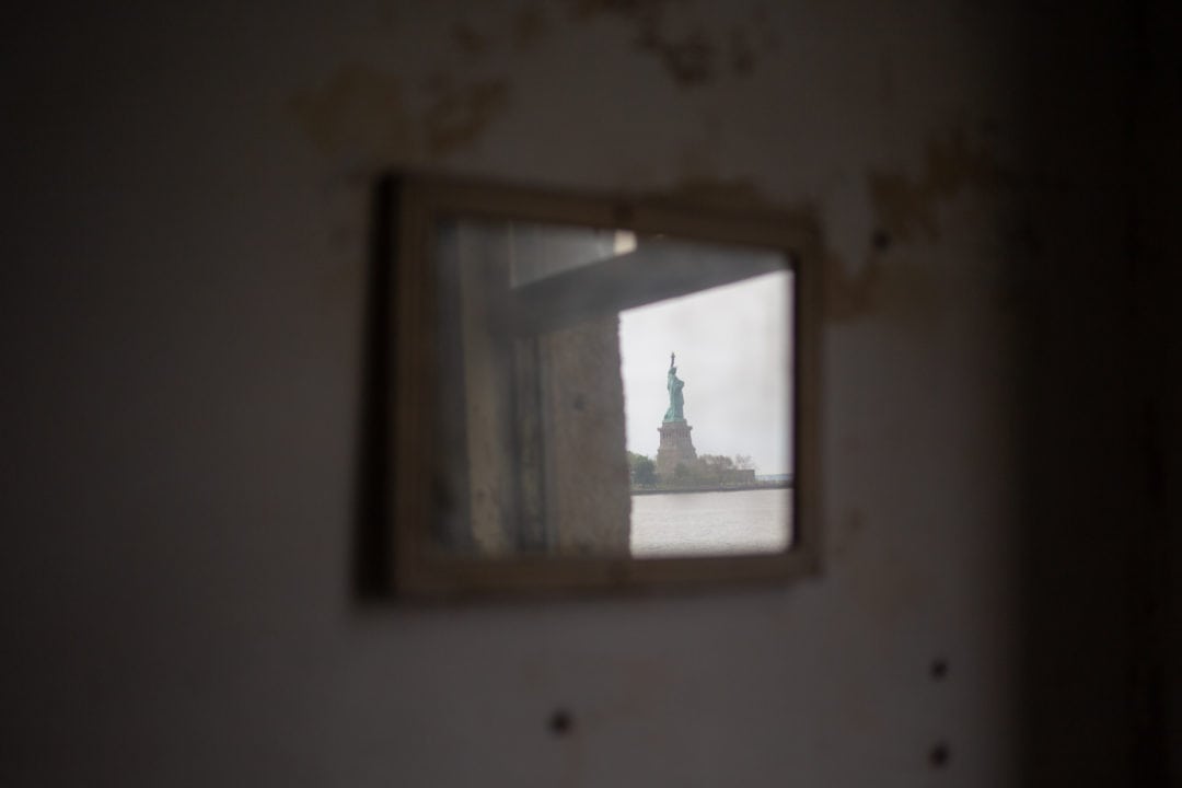 statue of liberty reflected in a mirror