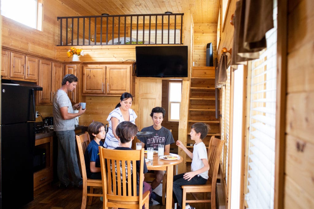Brandi and her family having breakfast in their cabin