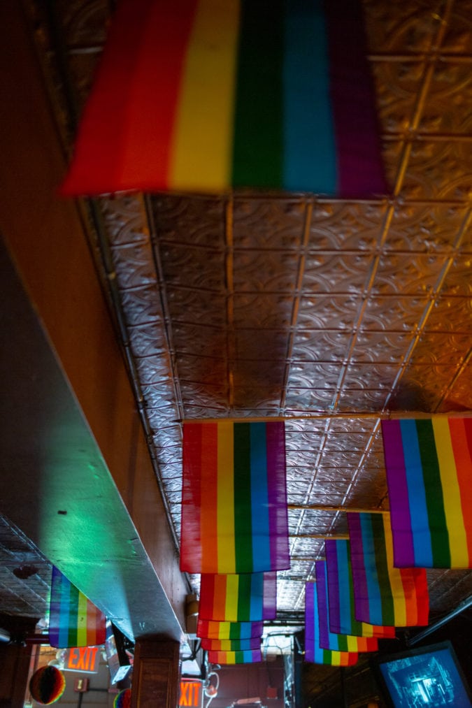 Pride flags inside of the Stonewall Inn.