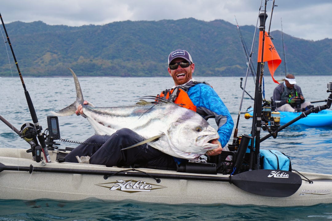 Posing with an extra large roosterfish kayak fishing