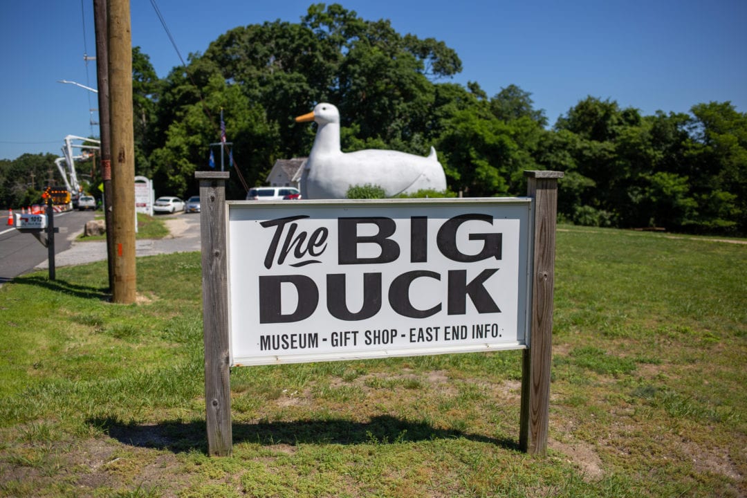 The Big Duck sign in front of the building