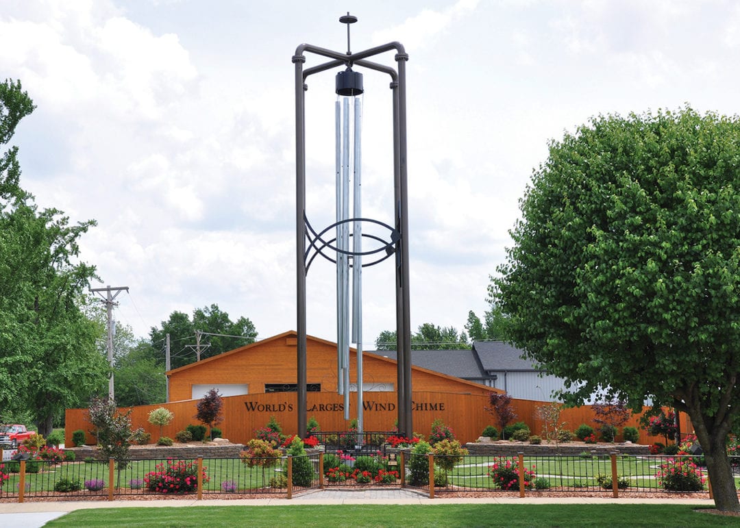 world's largest windchime, in front of a wooden building