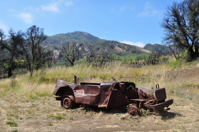 Prior to the Woolsey Fire, trees partially obstructed the view of the hillside behind this bombed out jeep prop from the M*A*S*H television site.
