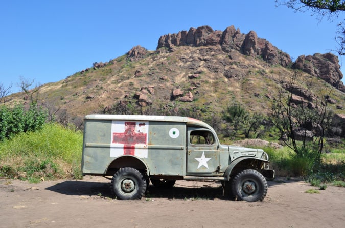An army ambulance from the television show M*A*S*H, below the namesake crags along Crags Road in Malibu Creek State Park