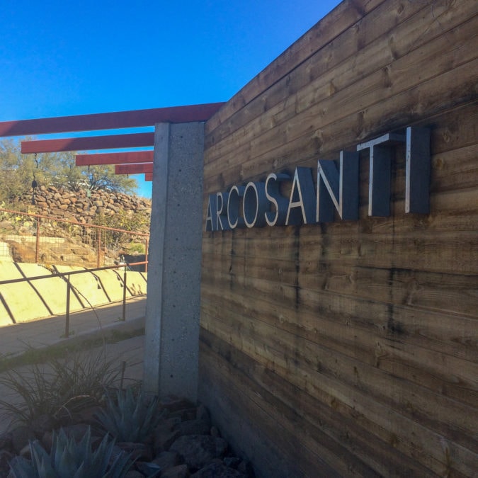 A sign welcoming visitors to Arcosanti. 