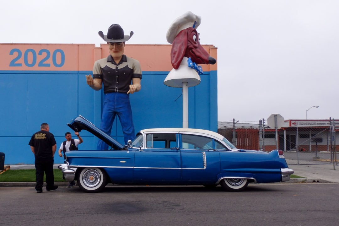 A cowboy Muffler Man and a Doggie Diner head.