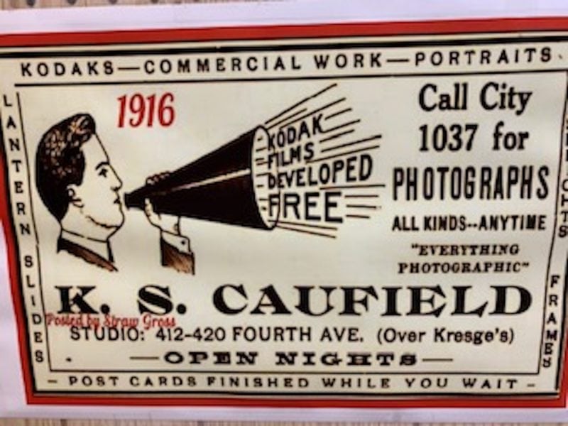 a sign from 1916 advertising the Caufield's photography business 