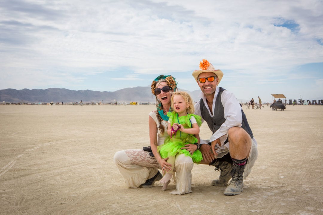 Jesse Gros, Devon Gros (age 2.5), and Alex Zech at Burning Man in 2016. 