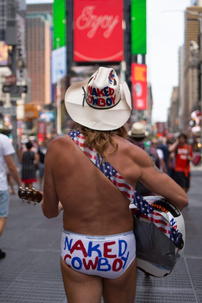 The naked cowboy arriving in Times Square