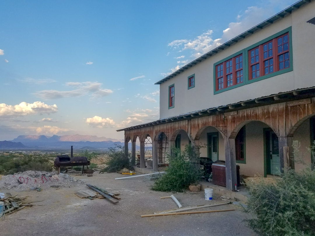 The restored Perry Mansion with a mountain view in the background 