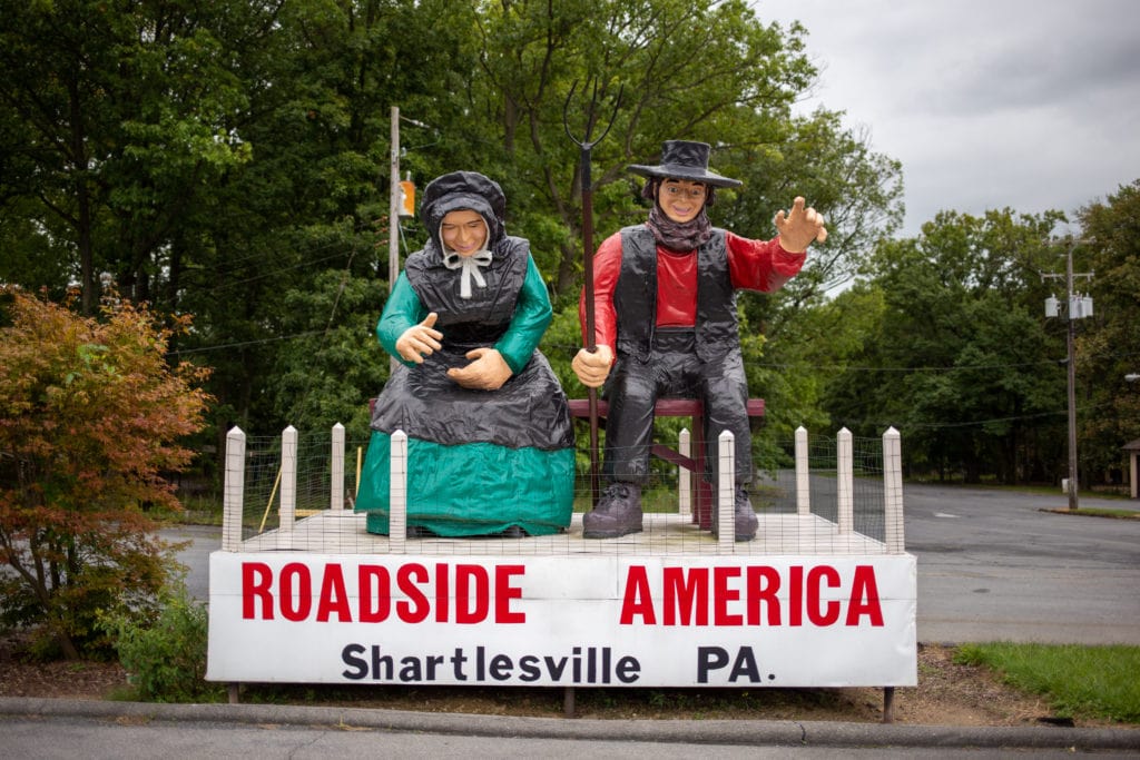 An Amish couple welcomes visitors to Roadside America.