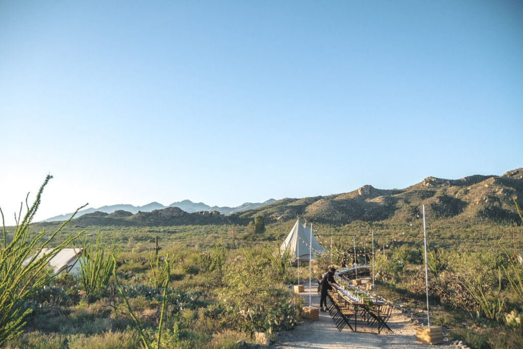 Canvas tent and dinner table in the middle of Tucson's Saguaro National Park