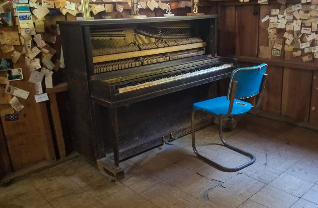 The old piano in the corner of the Gin Mill.