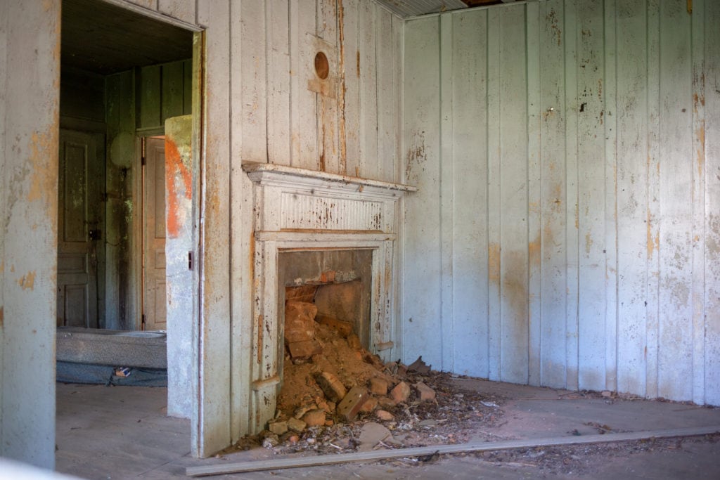 A fireplace inside one of the abandoned homes.
