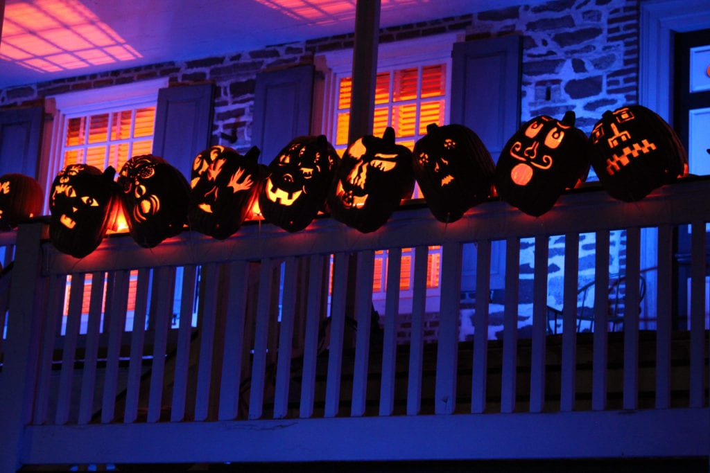 Pumpkins perched on a railing of Van Cortlandt Manor.