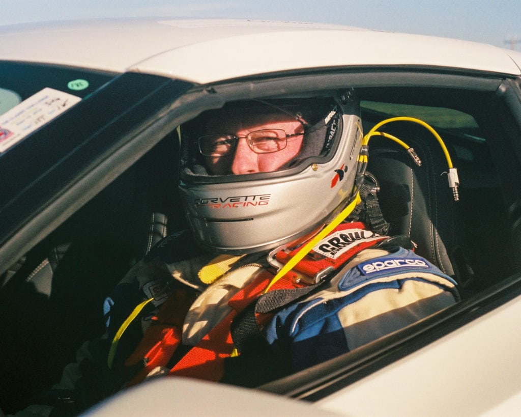 All strapped in a Corvette on race day. Depending on what speed class you drive in, drivers are required to have certain safety gear in order to qualify for the race