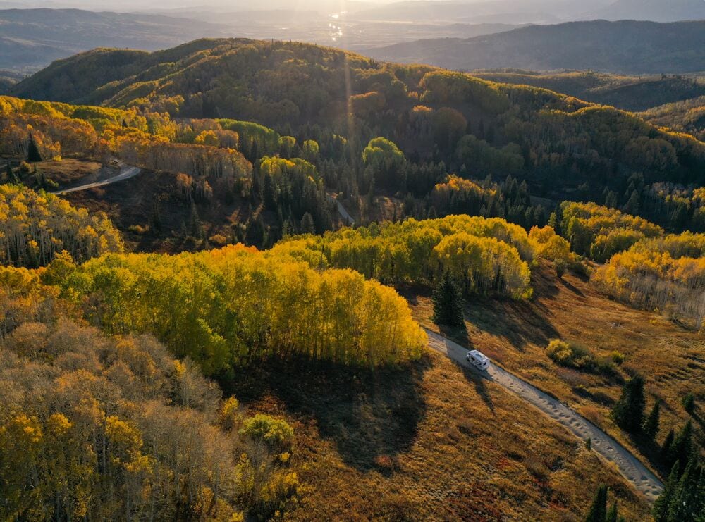America Adventure Thor Class-C RV Colorado mountain fall foliage golden trees