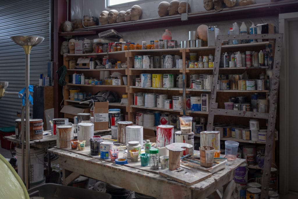 A wall of paint in Cline's workshop.