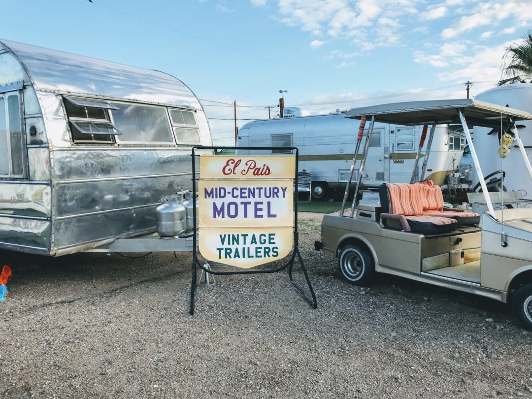 Silver trailer and golf cart at El Pais Motel in Tucson, Arizona