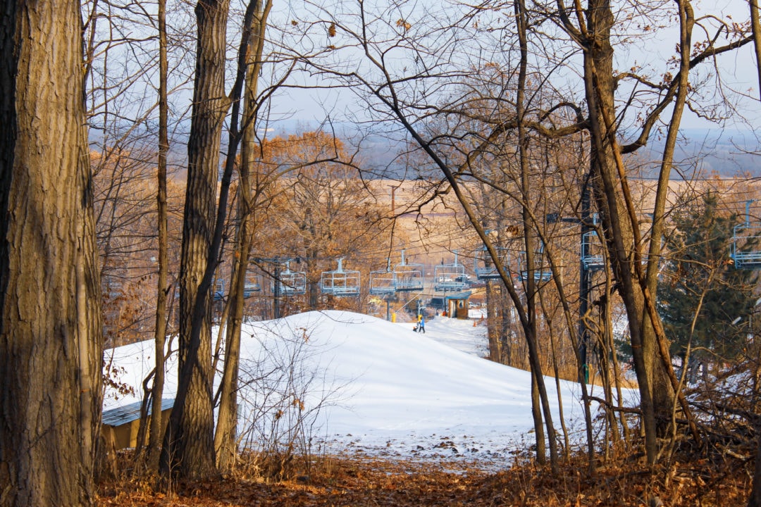Entry to Cascade Mountain ski run, surrounded by trees and leaves