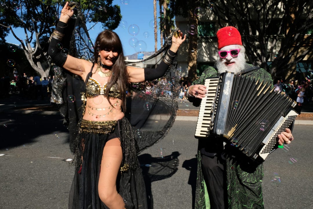 Former Doo Dah Queen Nancy “Narayana” Urbach belly dances in the parade to the sounds of Robert "Smokey" Miles’ accordion. Miles is seen here as his alter ego “Count Smokula,” a 496-year-old vampire from Smokesylvania who wears a cape and fez (and has a Gene Simmons-length tongue). They both have participated in the Doo Dah every year since it began.