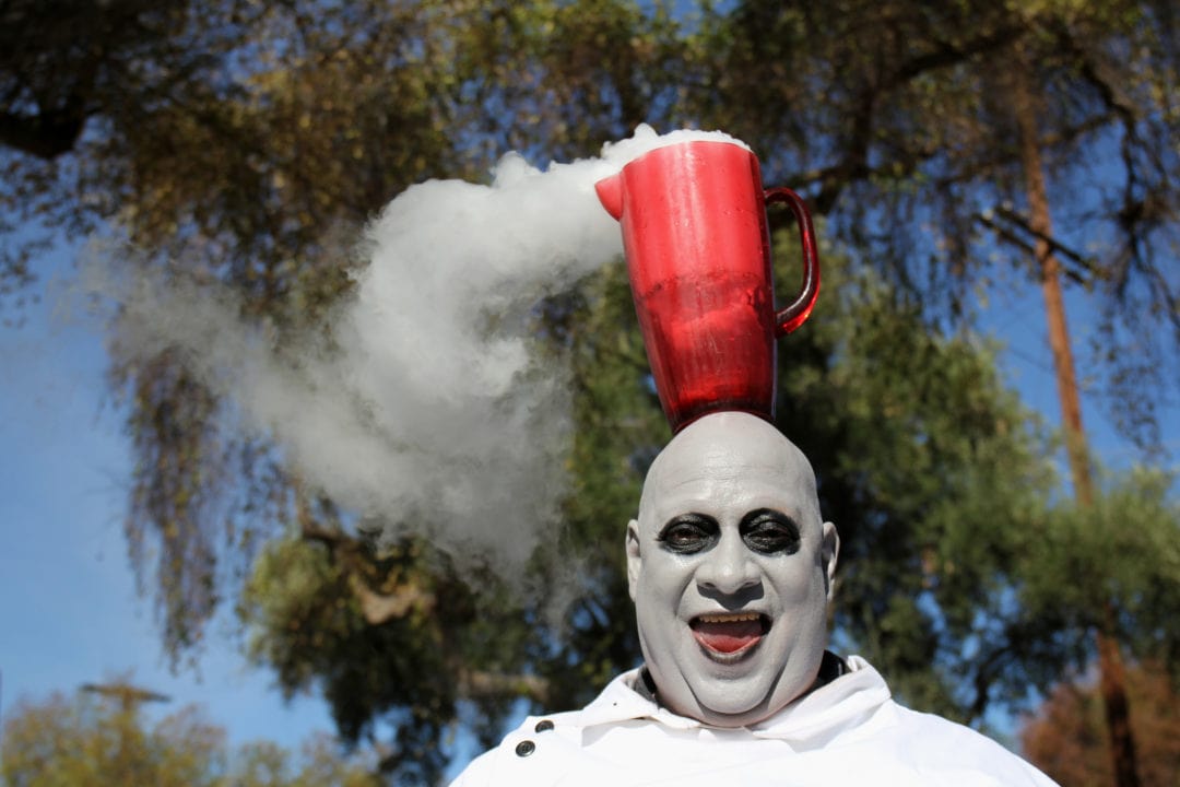 Charles F. Delvalle performs a variety act with dry ice concoctions while dressed as Uncle Fester. Many people have remarked on Devalle’s resemblance to The Addams Family character, so he has appeared as Uncle Fester in the Doo Dah parade since 1995. He wheels around a wagon of gadgets, gizmos, flashing lights, light bulbs, and a bubble machine. “Don’t let things fester,” Delvalle says.
