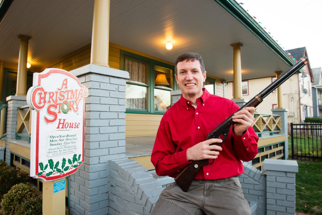 Museum owner Brian Jones holds the Red Rider BB Gun used in the movie at A Christmas Story House and Museum.