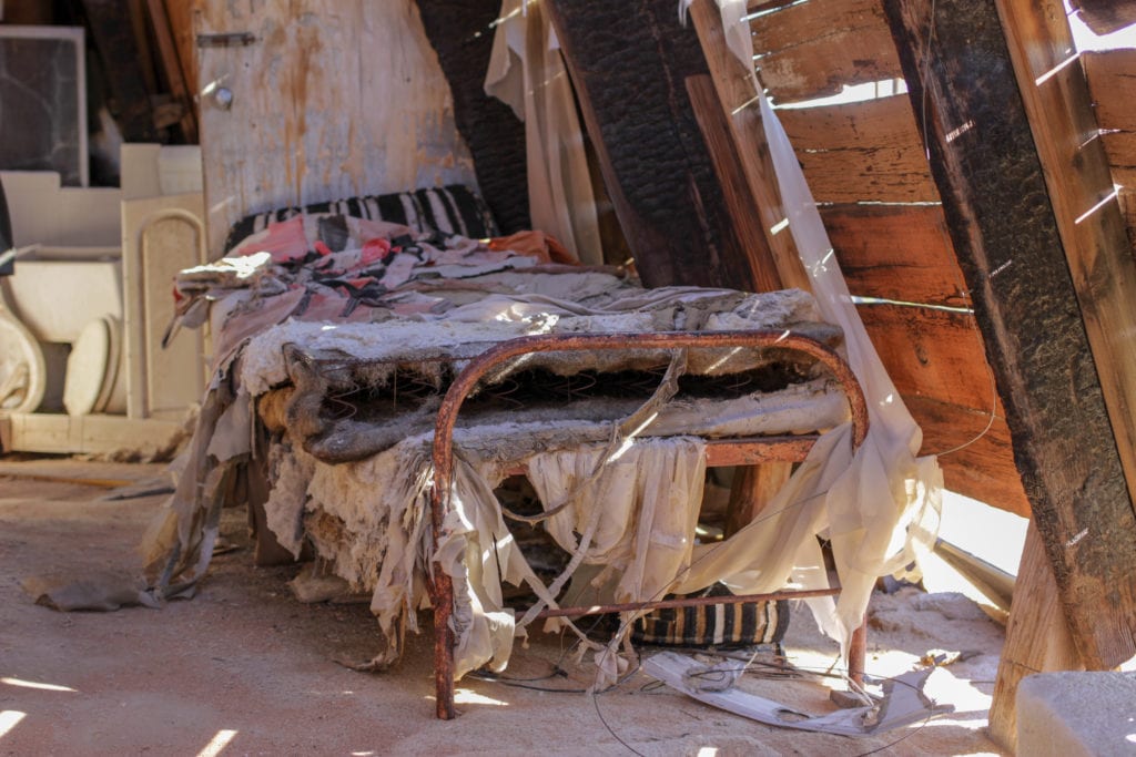 A tattered bed.