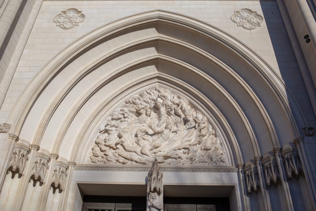 Completed in 1982, this depiction of the birth of mankind is above the central door.