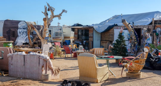 As Slab City grows, the community of outcasts, squatters, and desert dwellers grapples with the cost of its unique freedoms