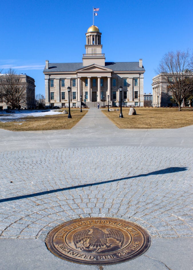 Iowa City Old Capitol Building walkway and University of Iowa plaque on ground