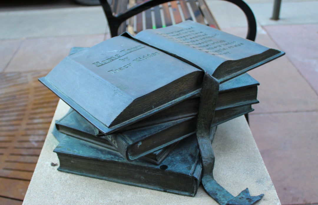 Close up of an open book statue in Iowa City on the Literary Walk