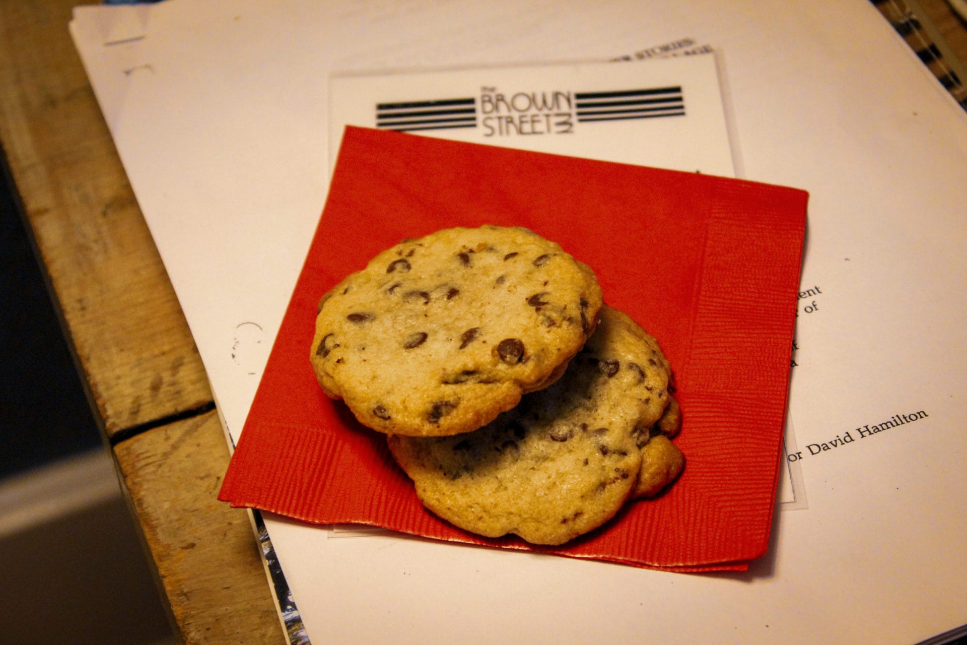 Close up of two chocolate chip cookies on a red napkin from the Brown Street Inn