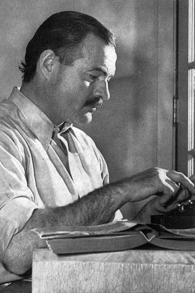 Hemingway posing for a dust jacket photo by Lloyd Arnold for the first edition of For Whom the Bell Tolls at the Sun Valley Lodge, Idaho, 1939.